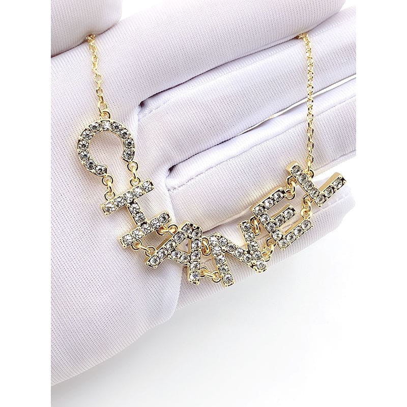 Chanel Crystal 90's Icon Logo 18K Gold Necklace product image 6, provided for visual reference and product detail review