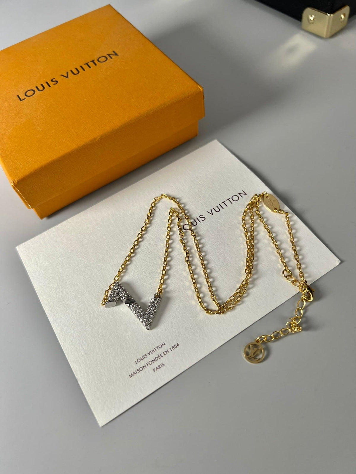 Louis Vuitton Volt Upside Down Pendant 18K Gold Necklace product image 6, provided for visual reference and product detail