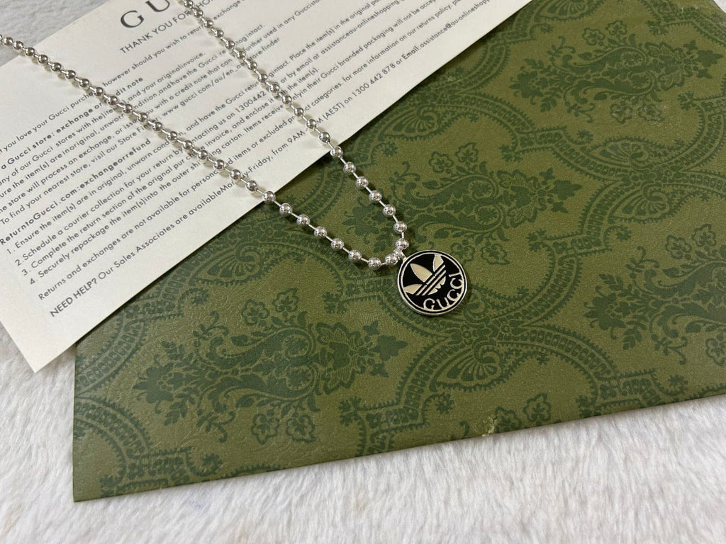 Double Gucci x Adidas Pendant Boule Necklace product image 10, provided for visual reference and product detail review