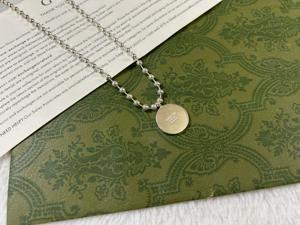 Double Gucci x Adidas Pendant Boule Necklace product image 2, provided for visual reference and product detail review