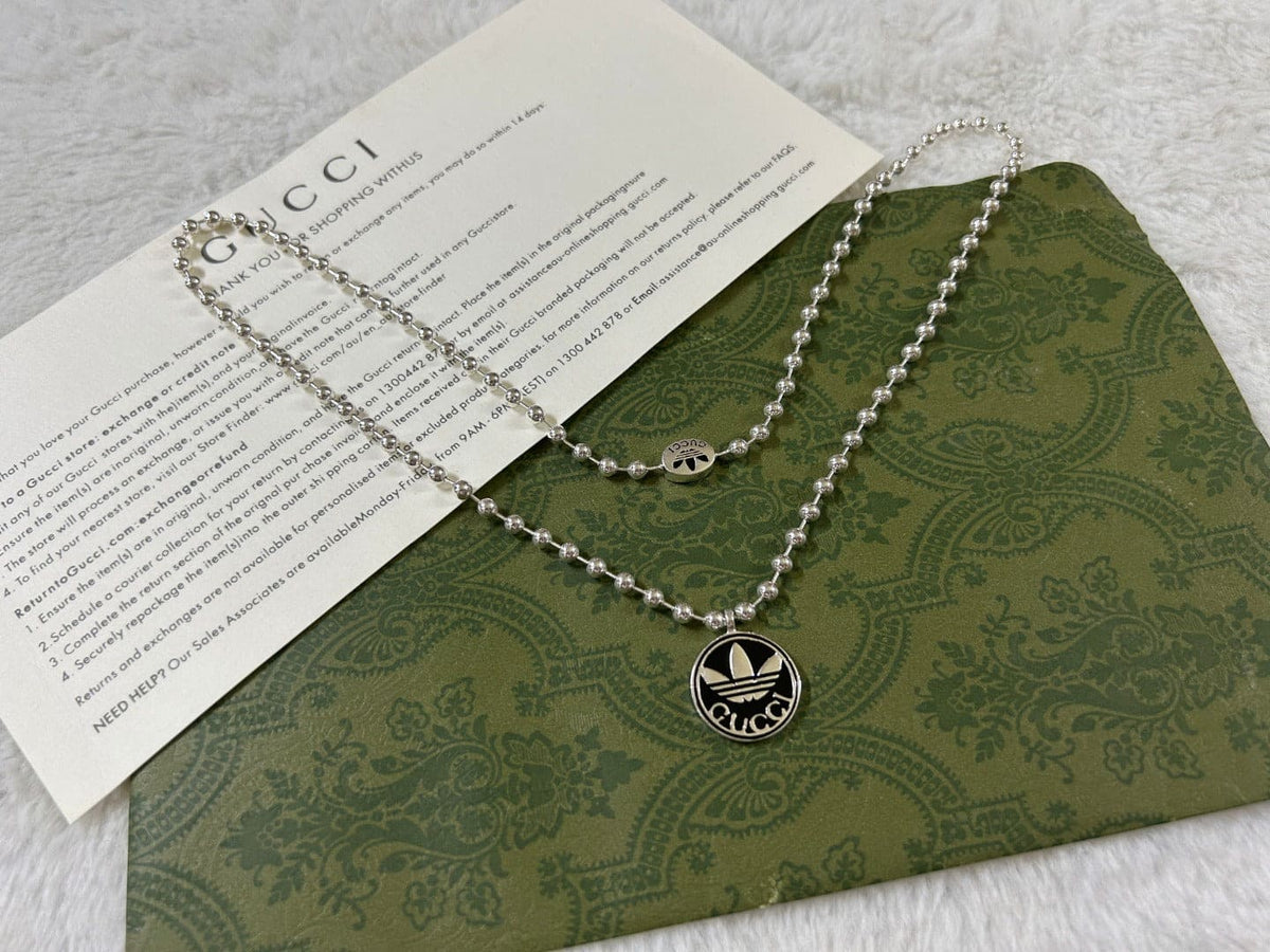 Double Gucci x Adidas Pendant Boule Necklace product image 3, provided for visual reference and product detail review