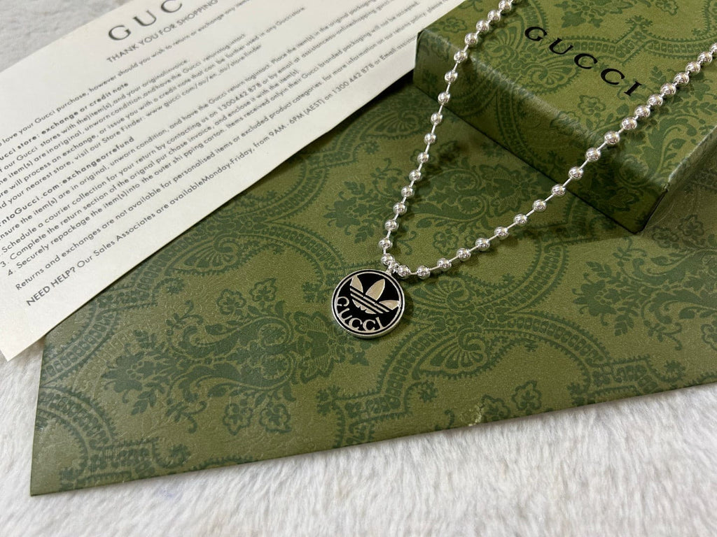 Double Gucci x Adidas Pendant Boule Necklace product image 8, provided for visual reference and product detail review