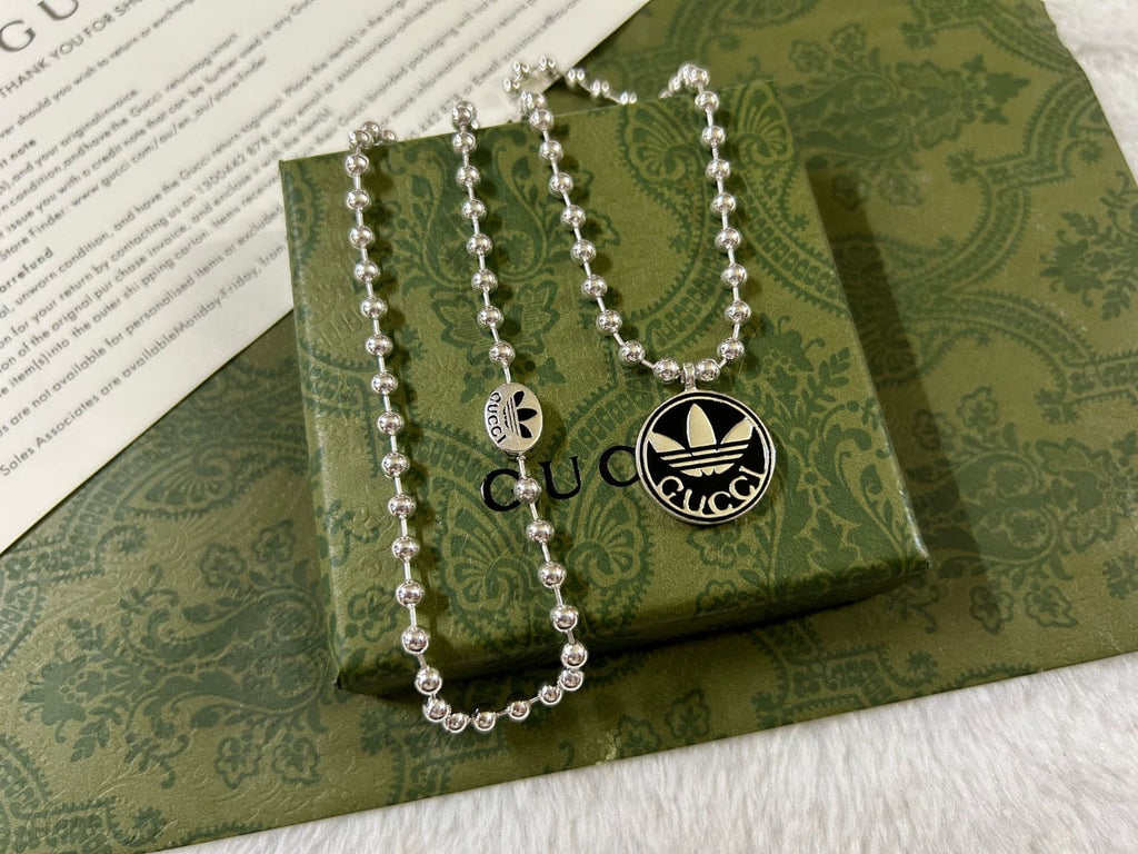 Double Gucci x Adidas Pendant Boule Necklace product image 4, provided for visual reference and product detail review