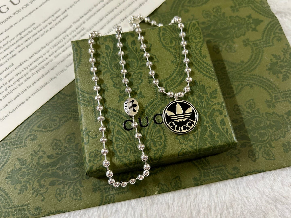 Double Gucci x Adidas Pendant Boule Necklace product image 4, provided for visual reference and product detail review