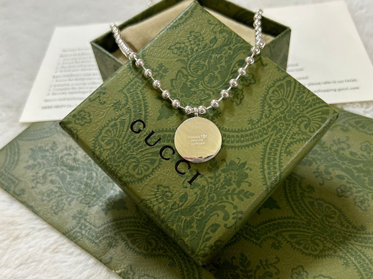 Double Gucci x Adidas Pendant Boule Necklace product image 6, provided for visual reference and product detail review