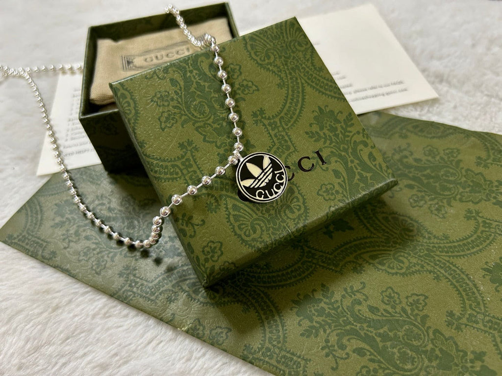 Double Gucci x Adidas Pendant Boule Necklace product image 7, provided for visual reference and product detail review