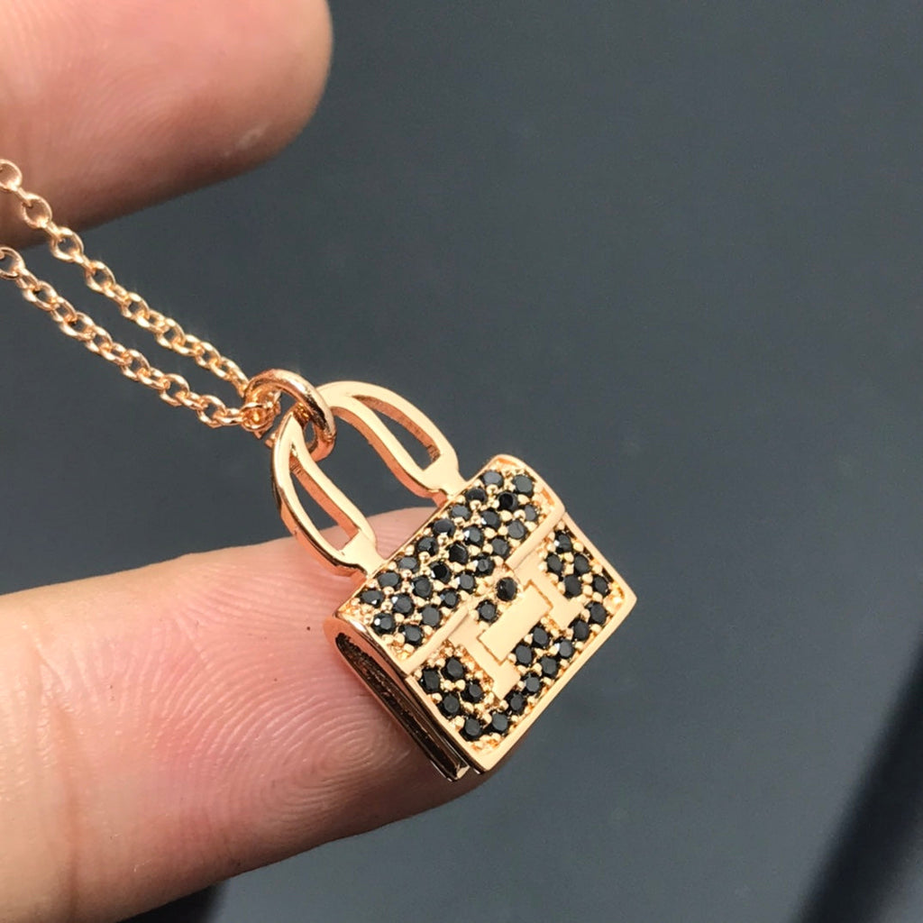 Hermes Amulettes Kelly Black Diamonds 18K Gold Necklace product image 5, provided for visual reference and product detail