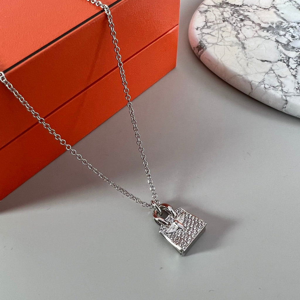 Hermes Amulettes Birkin Pendant 18K Gold Necklace product image 2, provided for visual reference and product detail review