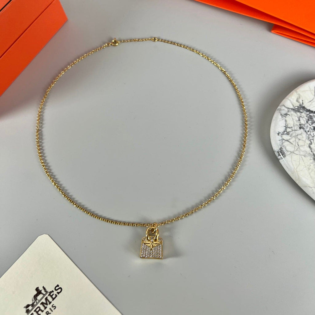 Hermes Amulettes Birkin Pendant 18K Gold Necklace product image 4, provided for visual reference and product detail review