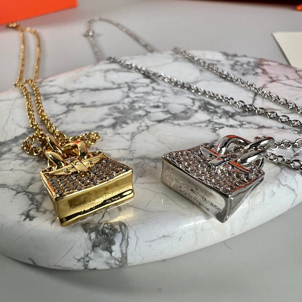Hermes Amulettes Birkin Pendant 18K Gold Necklace product image 3, provided for visual reference and product detail review