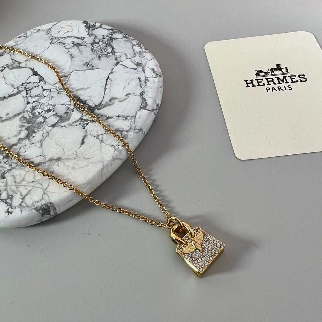 Hermes Amulettes Birkin Pendant 18K Gold Necklace product image 2, provided for visual reference and product detail review
