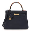 Togo Horseshoe Au Galop Kelly Retourne 28 Bleu Nuit Rouge H Fauve product image 1, provided for visual reference and product