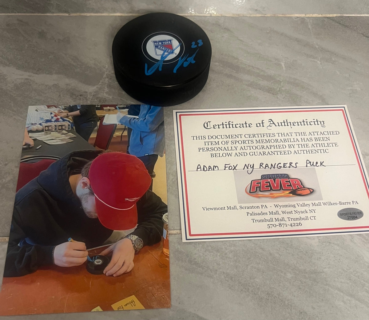 Adam Fox New York Rangers autographed hockey puck with COA product image 1