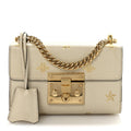 Grained Calfskin Bee Star Small Padlock Shoulder Bag White product image 1, provided for visual reference and product detail