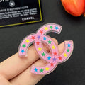 Chanel Pink & Black Star 18K Gold Brooch product image 1, provided for visual reference and product detail review