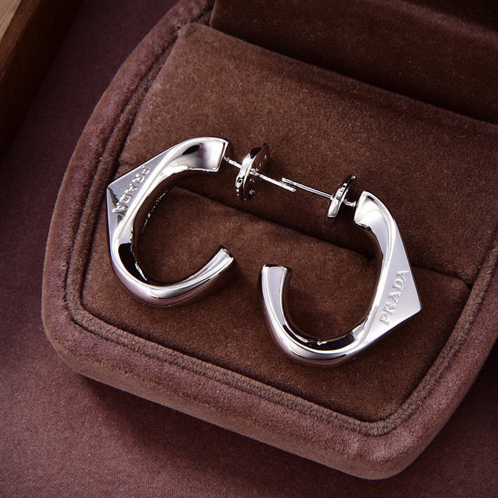 Prada Triangle Open 18K Gold Earrings product image 1, provided for visual reference and product detail review