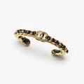 Chanel Black Leather Cuff 18K Gold Bracelet product image 1, provided for visual reference and product detail review