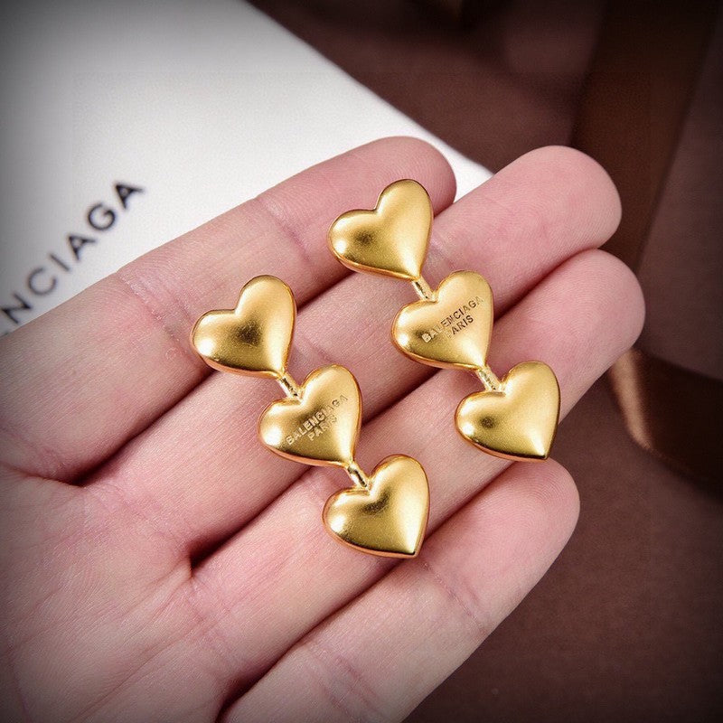 Balenciaga Three Heart Gold 18K Gold Earrings product image 1, provided for visual reference and product detail review