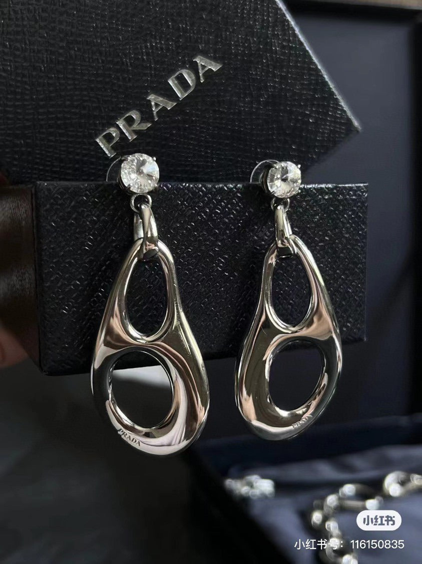 Prada Inverted Triangle 18K Gold Earrings product image 4, provided for visual reference and product detail review