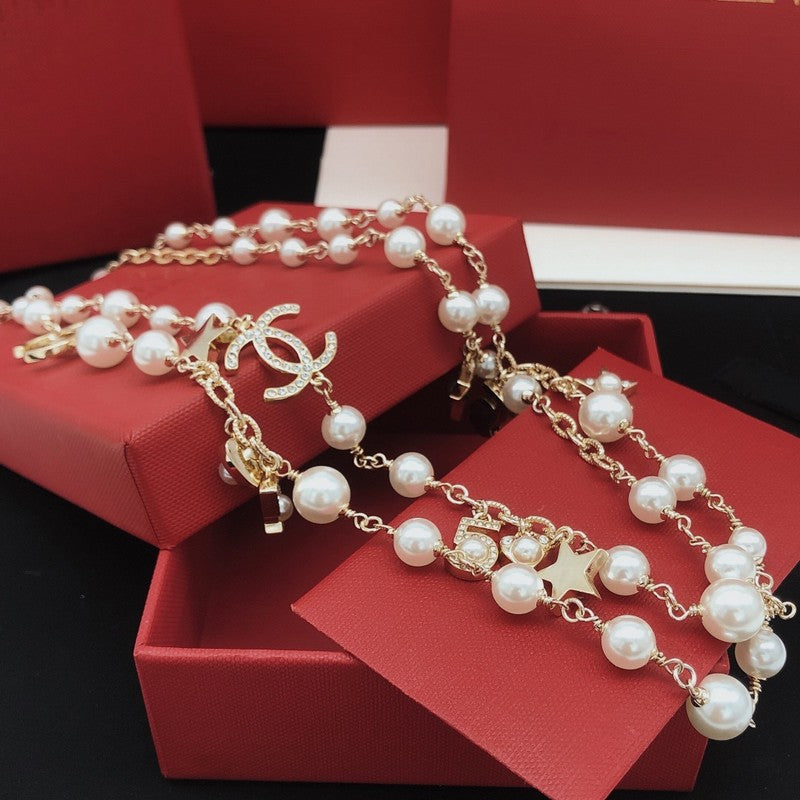 Chanel No.5 Star Long Pearl 18K Gold Necklace product image 3, provided for visual reference and product detail review