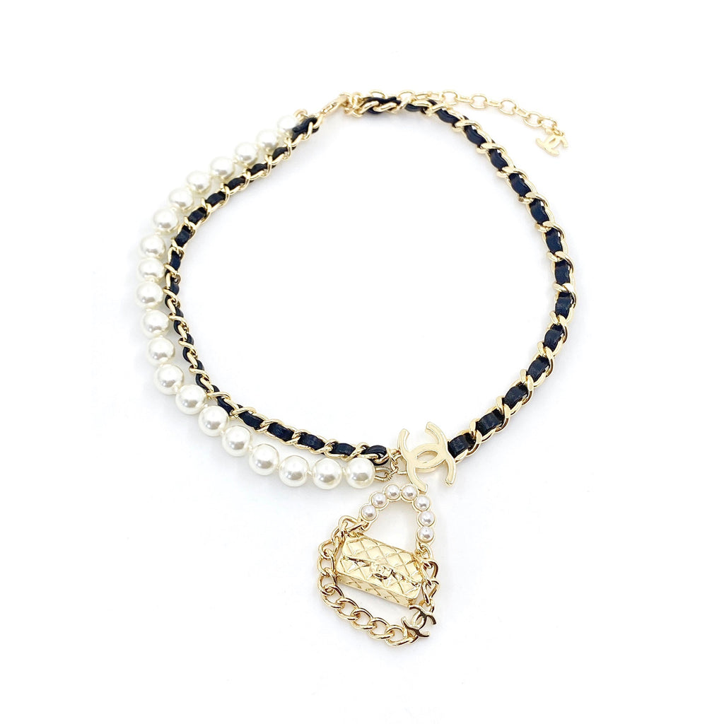 Chanel Pearl Bag Pendant 18K Gold Necklace product image 1, provided for visual reference and product detail review