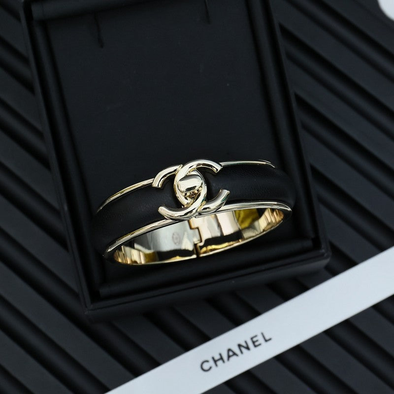 Chanel Black Leather Cuff 18K Gold Bracelet product image 1, provided for visual reference and product detail review