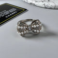 Chanel Bow Tie Pearls 18K Gold Ring product image 1, provided for visual reference and product detail review