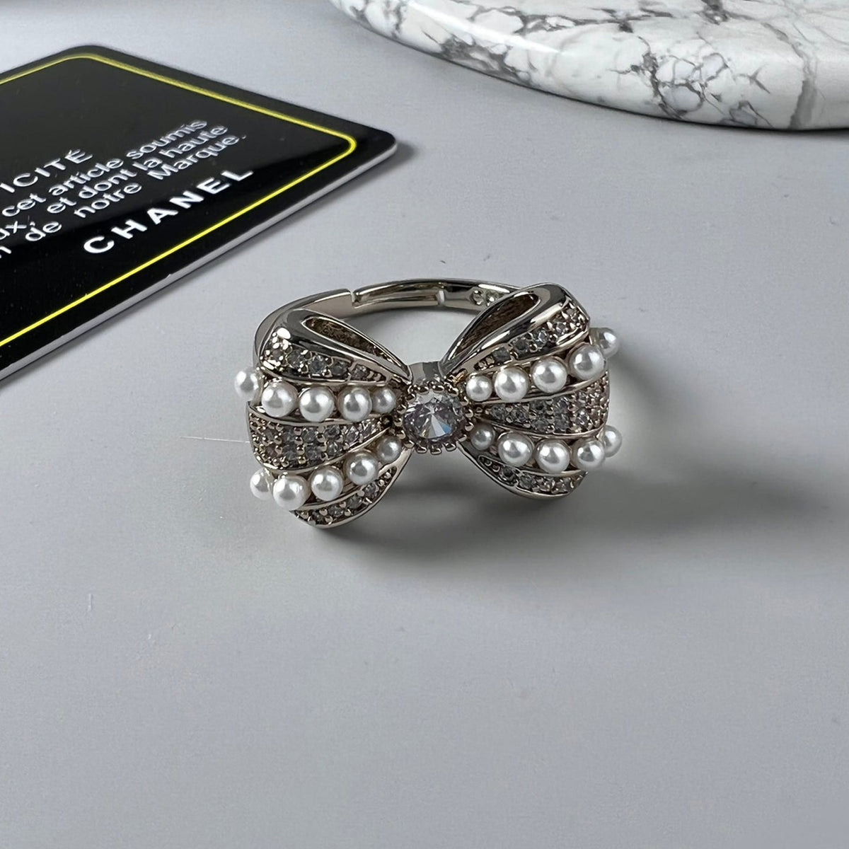 Chanel Bow Tie Pearls 18K Gold Ring product image 1, provided for visual reference and product detail review