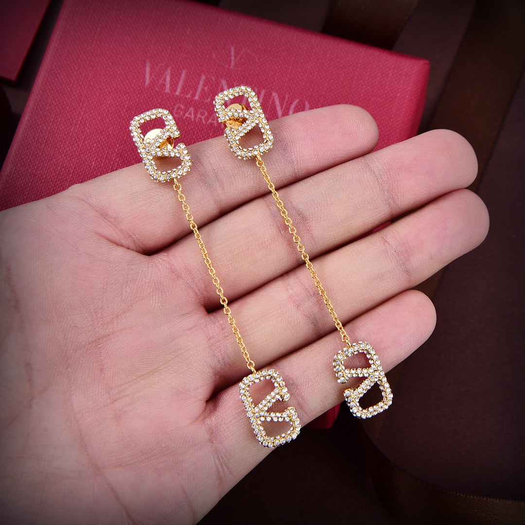 Valentino Crystal Valentino Signature 18K Gold Earrings product image 3, provided for visual reference and product detail