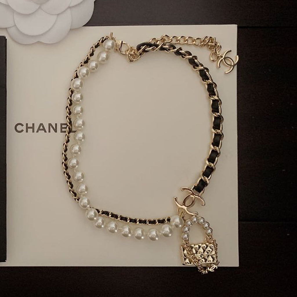 Chanel Pearl Leather Bag Pendant 18K Gold Necklace product image 1, provided for visual reference and product detail review