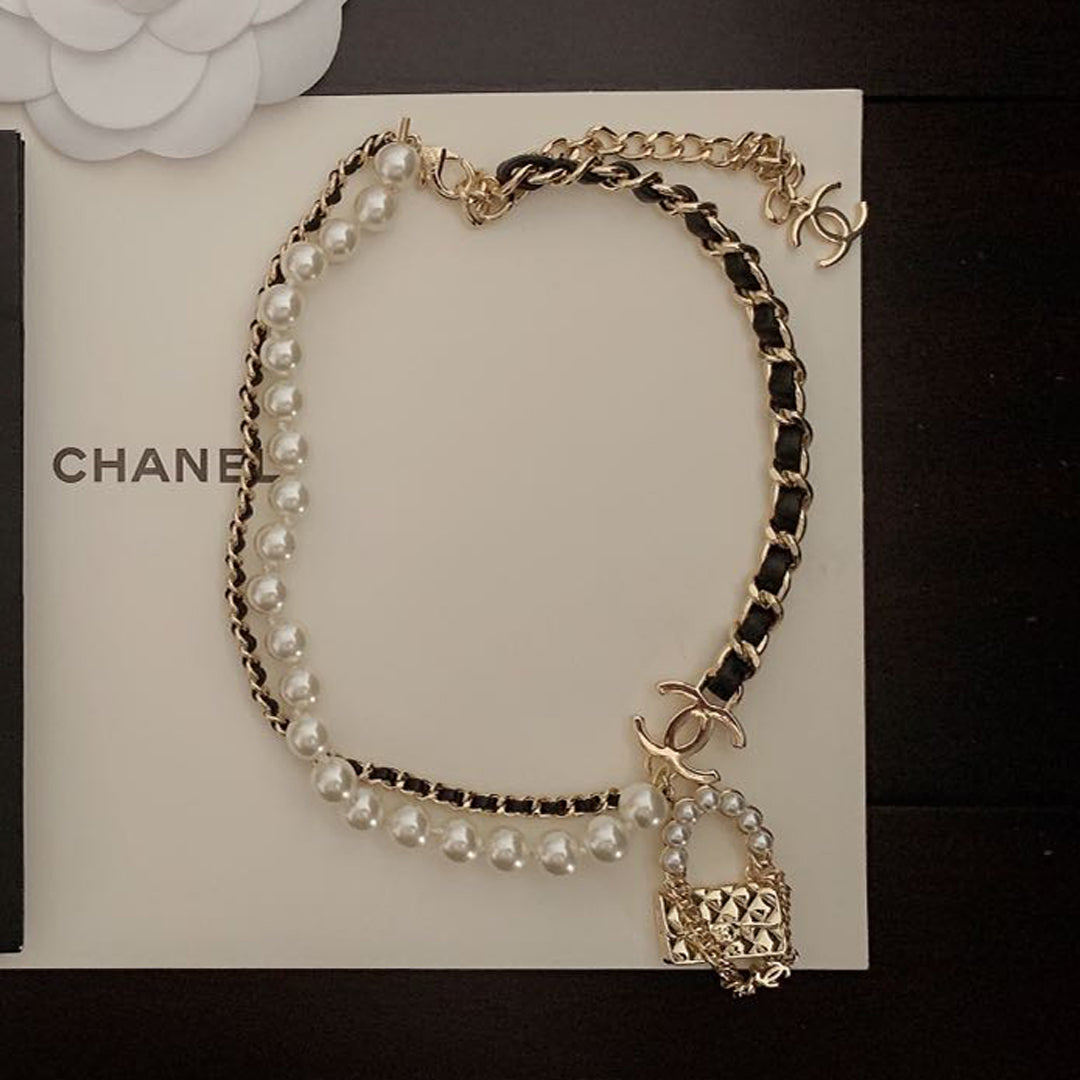 Chanel Pearl Leather Bag Pendant 18K Gold Necklace product image 1, provided for visual reference and product detail review