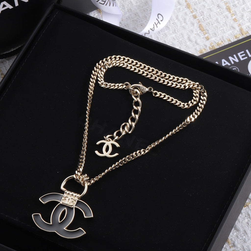 Chanel Black Resin Logo 18K Gold Necklace product image 1, provided for visual reference and product detail review