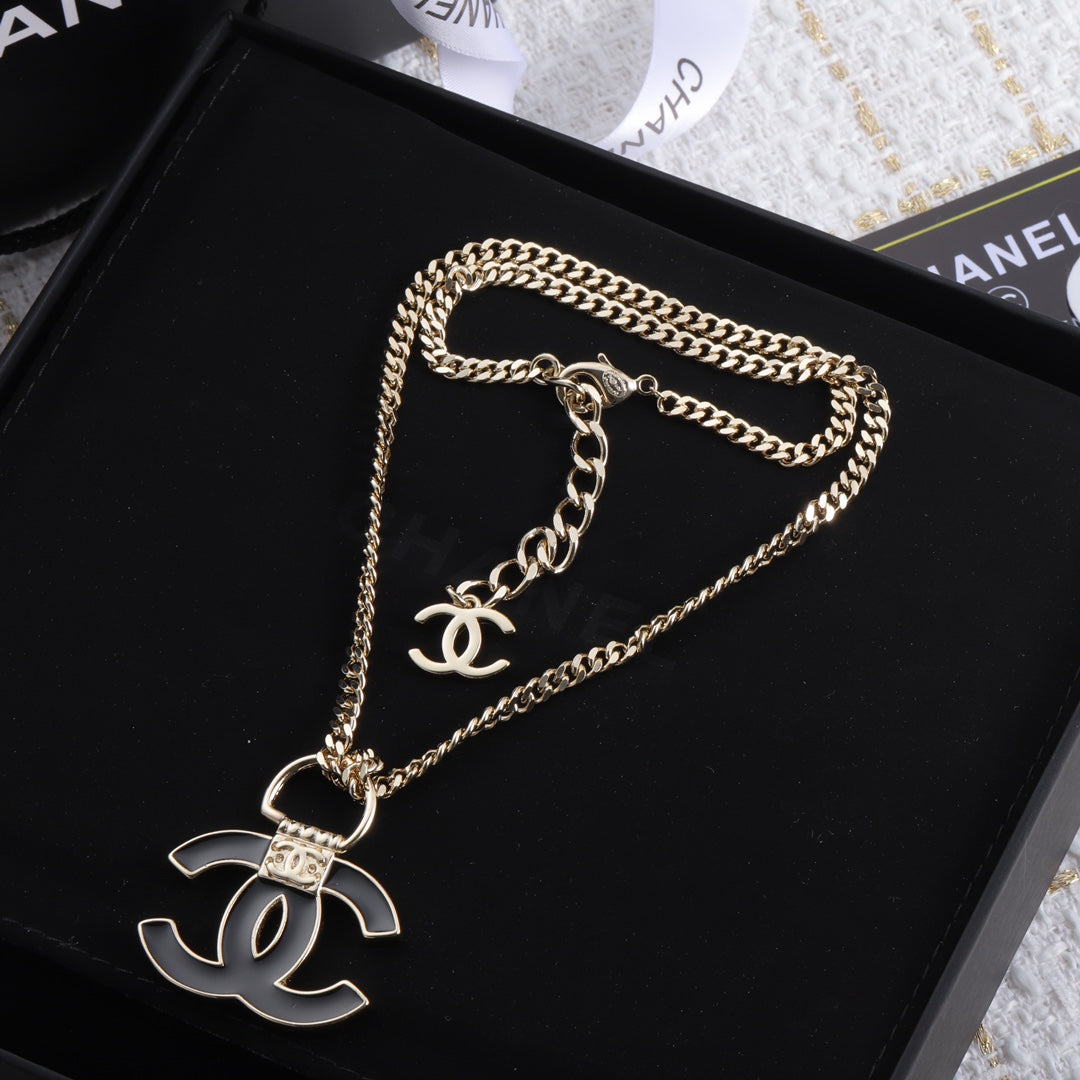 Chanel Black Resin Logo 18K Gold Necklace product image 1, provided for visual reference and product detail review