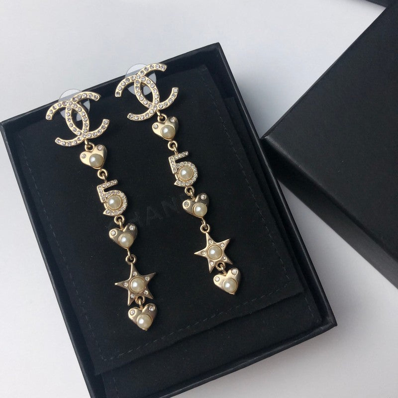 Chanel No.5 Long 18K Gold Earrings product image 2, provided for visual reference and product detail review