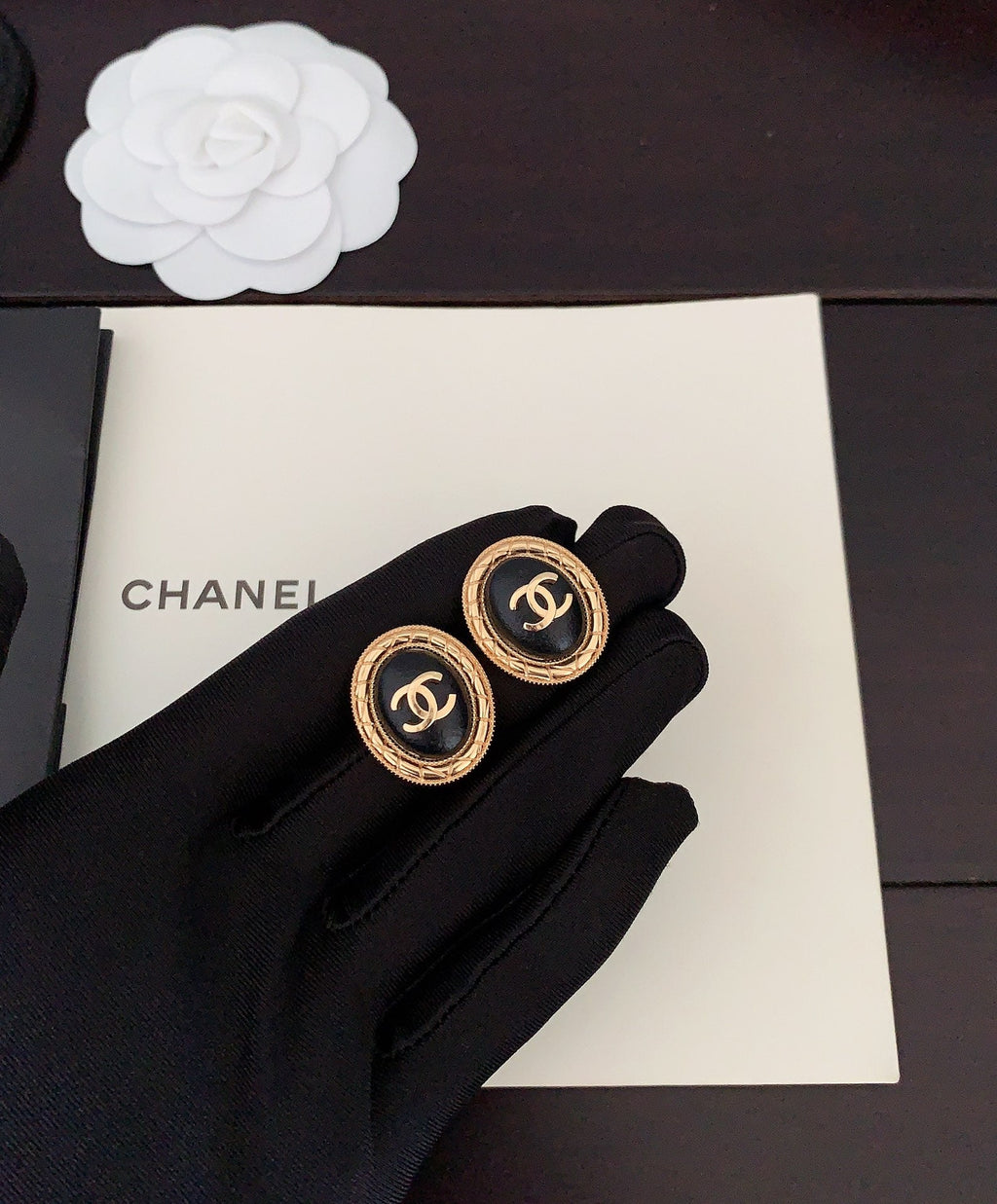 Chanel Oval Leather 18K Gold Earrings product image 3, provided for visual reference and product detail review