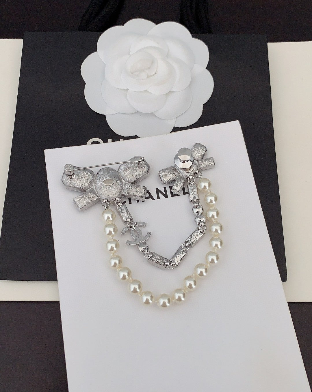 Chanel Black Bow Pearls 18K Gold Brooch product image 2, provided for visual reference and product detail review