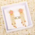 Dior Petit Tassel 18K Gold Earrings product image 1, provided for visual reference and product detail review