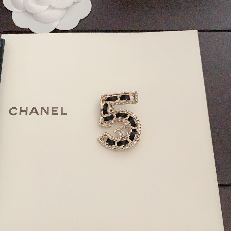 Chanel No.5 Leather Diamond 18K Gold Brooch product image 4, provided for visual reference and product detail review