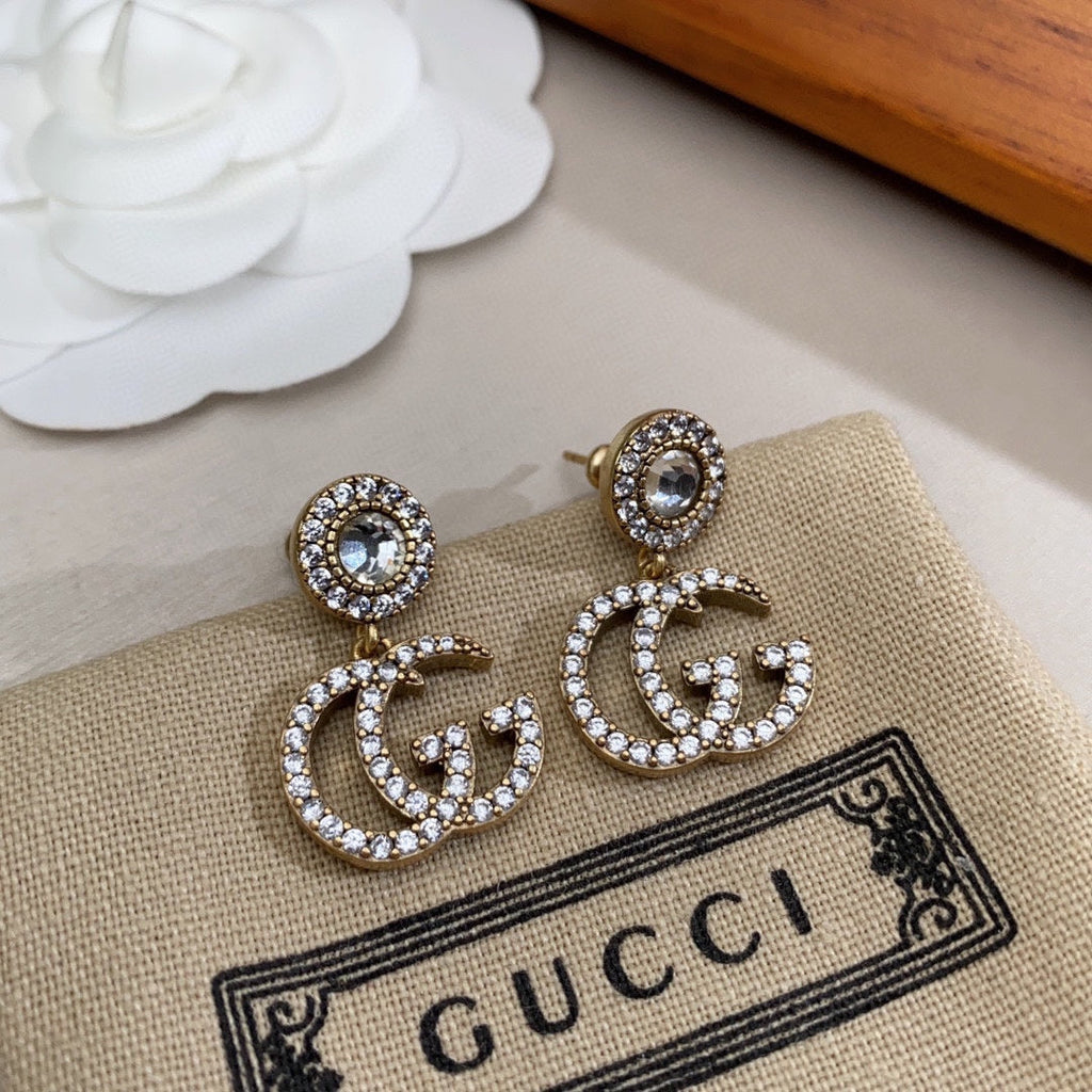 Gucci Double Crystal Pendant 18K Gold Earrings product image 1, provided for visual reference and product detail review