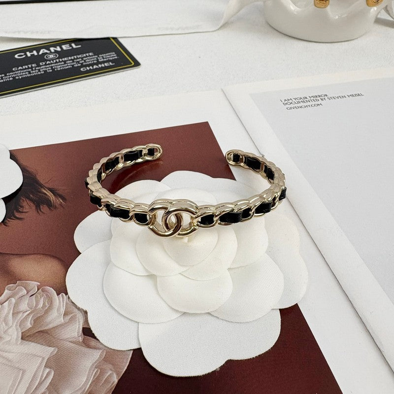Chanel Black Leather Cuff 18K Gold Bracelet product image 2, provided for visual reference and product detail review