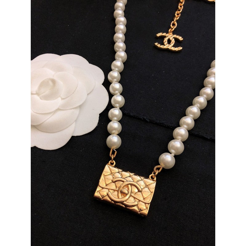Chanel Pearl Bag Pendant 18K Gold Necklace product image 5, provided for visual reference and product detail review