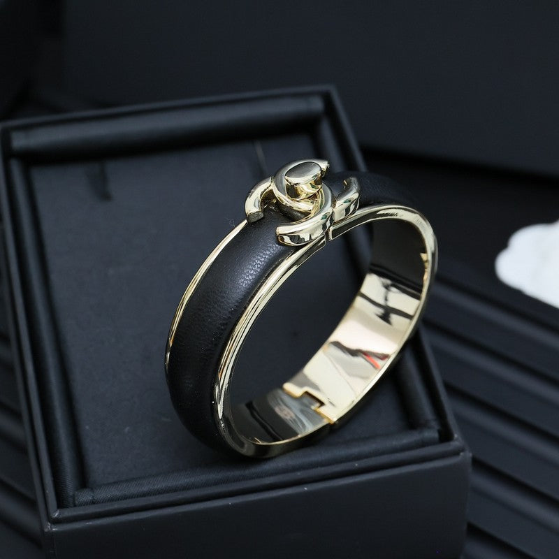 Chanel Black Leather Cuff 18K Gold Bracelet product image 2, provided for visual reference and product detail review