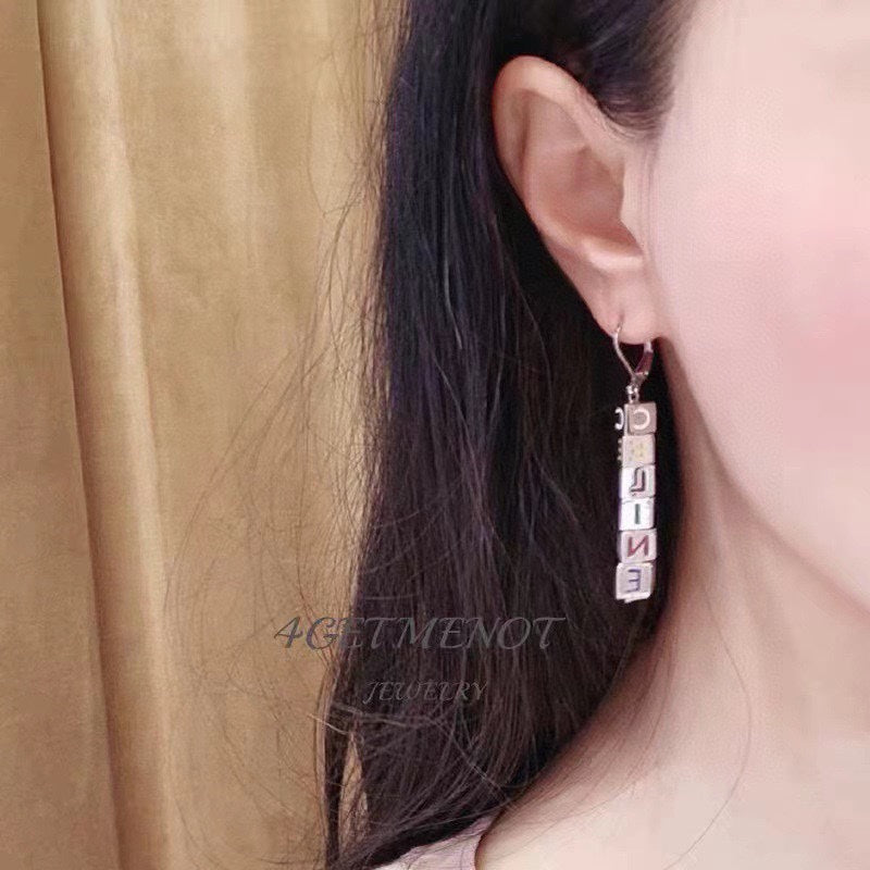 Celine Script Cube 18K Gold Earrings product image 2, provided for visual reference and product detail review