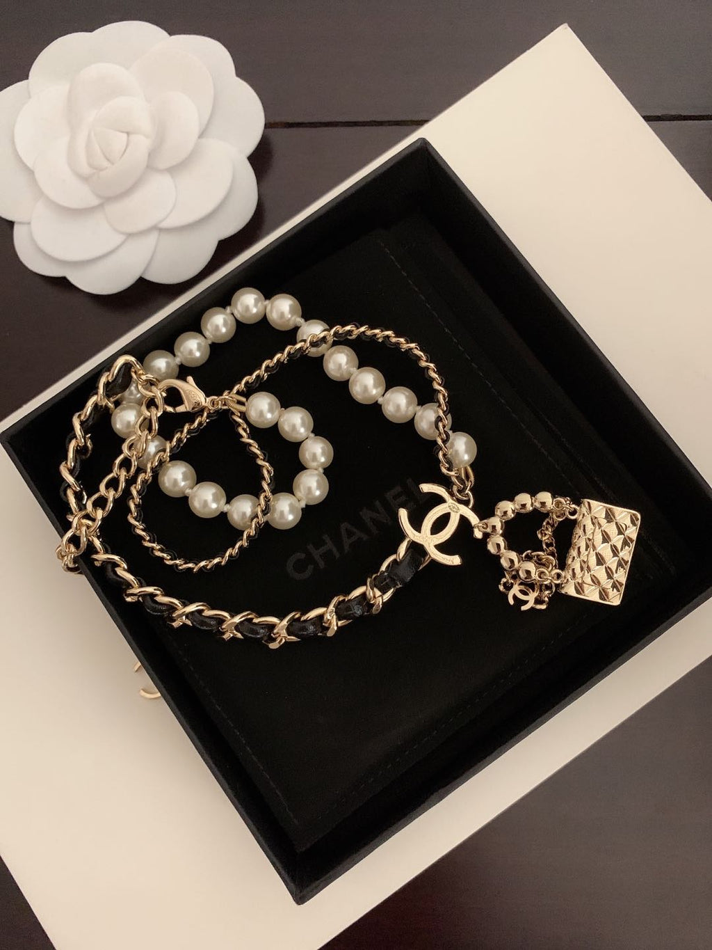 Chanel Pearl Leather Bag Pendant 18K Gold Necklace product image 3, provided for visual reference and product detail review