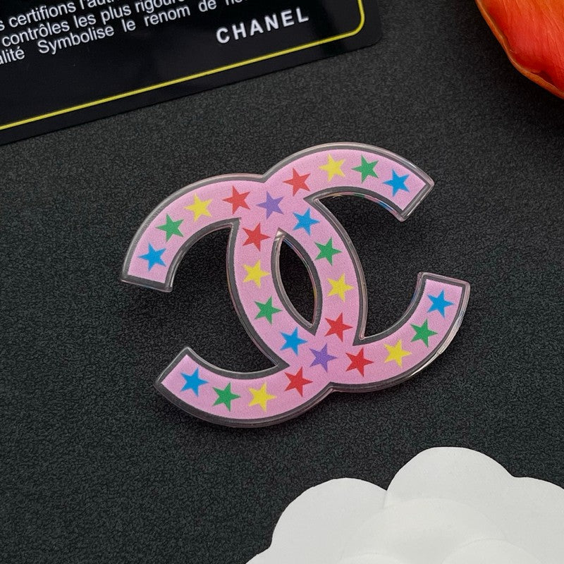 Chanel Pink & Black Star 18K Gold Brooch product image 2, provided for visual reference and product detail review
