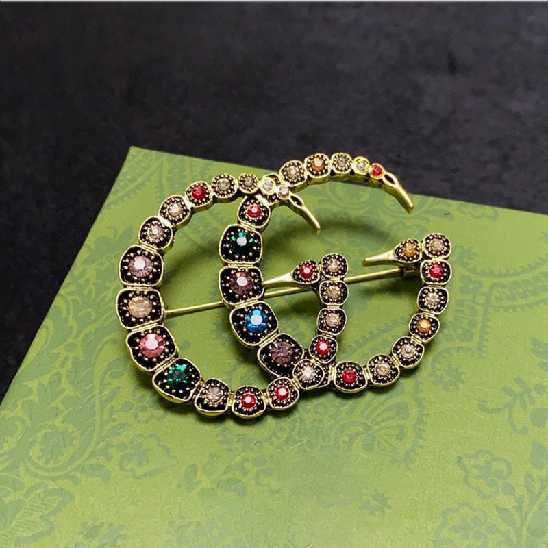 Gucci Double Color Crystal 18K Gold Brooch product image 1, provided for visual reference and product detail review