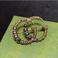 Gucci Double Color Crystal 18K Gold Brooch product image 1, provided for visual reference and product detail review