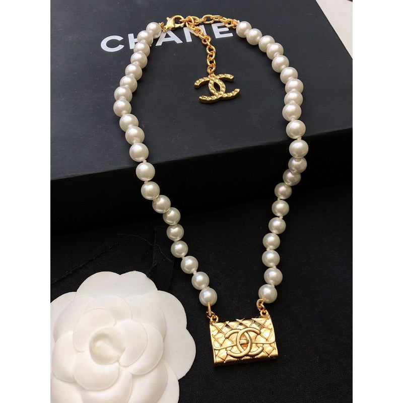 Chanel Pearl Bag Pendant 18K Gold Necklace product image 2, provided for visual reference and product detail review