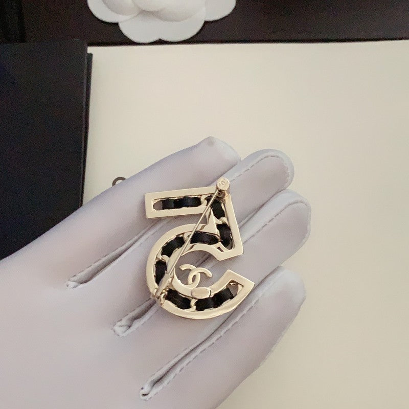 Chanel No.5 Leather Diamond 18K Gold Brooch product image 3, provided for visual reference and product detail review