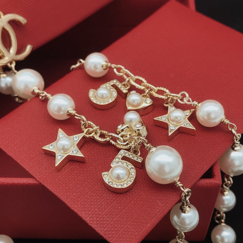 Chanel No.5 Star Long Pearl 18K Gold Necklace product image 5, provided for visual reference and product detail review